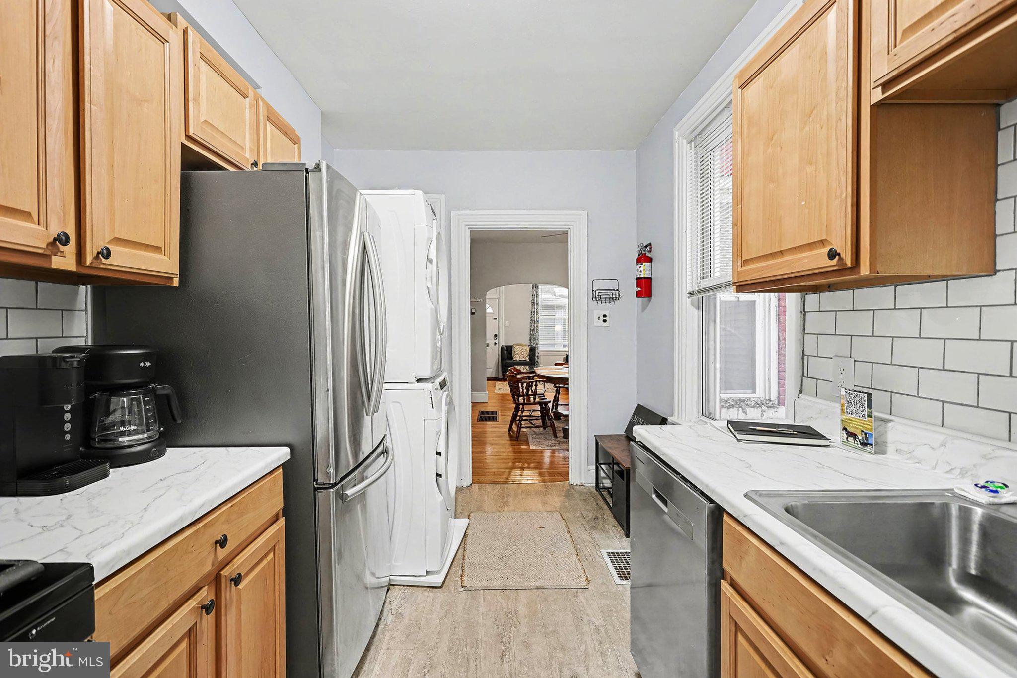 353 East Marion Street Lancaster, PA 17602 - Photo 16 of 28 a kitchen with stainless steel appliances granite countertop a sink stove and refrigerator