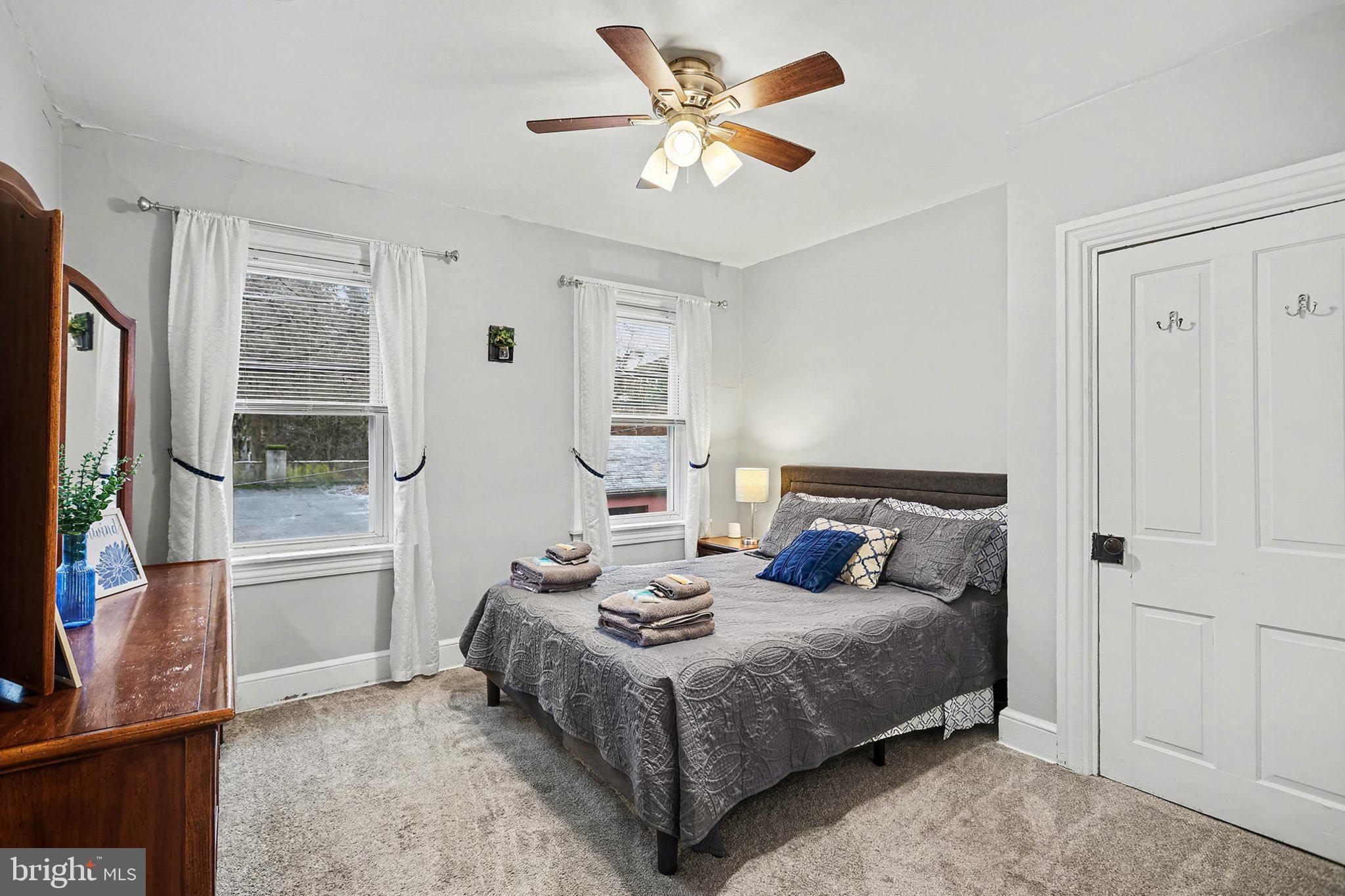 353 East Marion Street Lancaster, PA 17602 - Photo 17 of 28 a bedroom with a bed a window and a flat screen tv