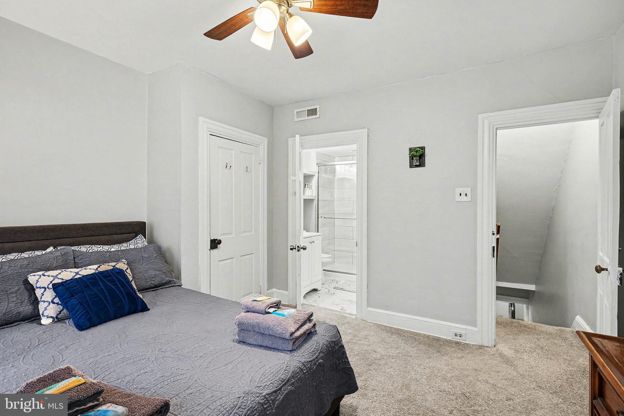 353 East Marion Street Lancaster, PA 17602 - Photo 18 of 28 a bedroom with a bed and a chandelier