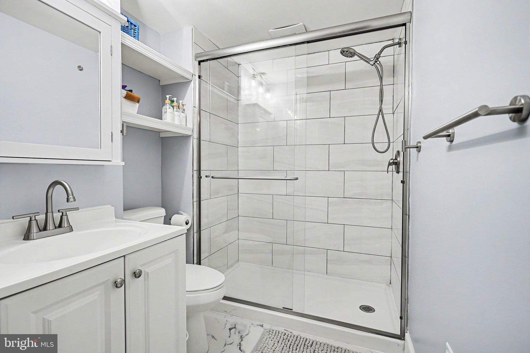353 East Marion Street Lancaster, PA 17602 - Photo 20 of 28 a bathroom with a shower sink vanity and toilet