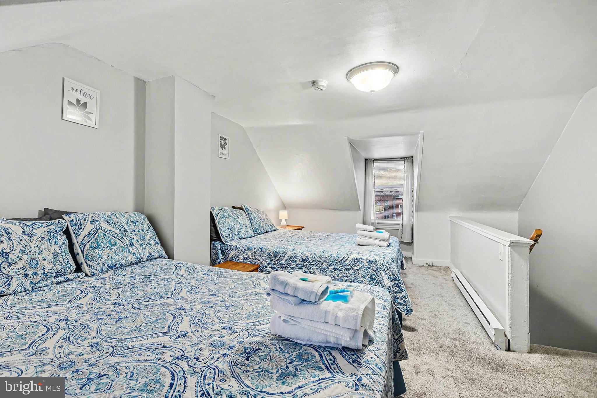 353 East Marion Street Lancaster, PA 17602 - Photo 23 of 28 a bedroom with a bed and a couch