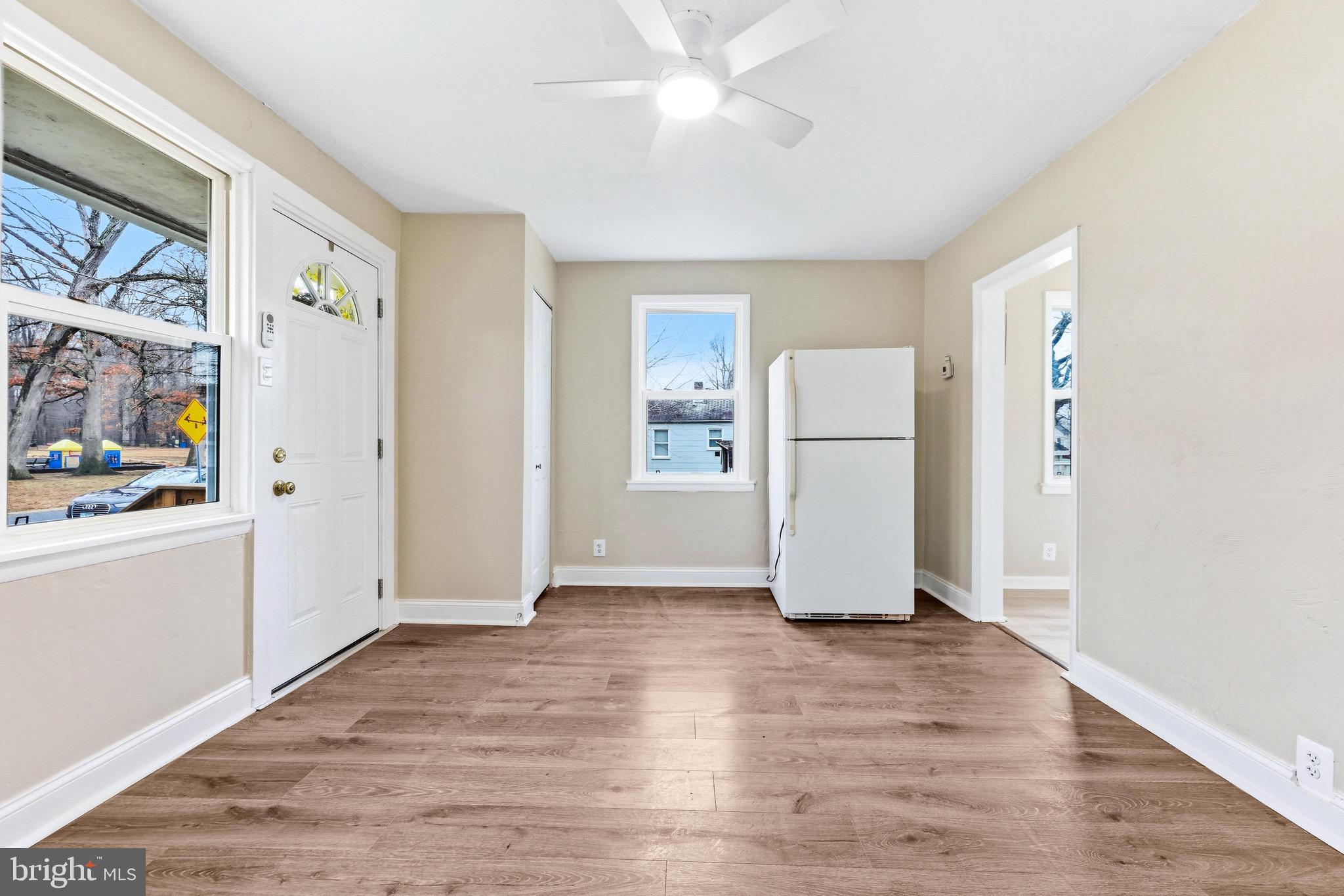 3 Victory Street Aberdeen, MD 21001 - Photo 11 of 26 an empty room with wooden floor and white walls