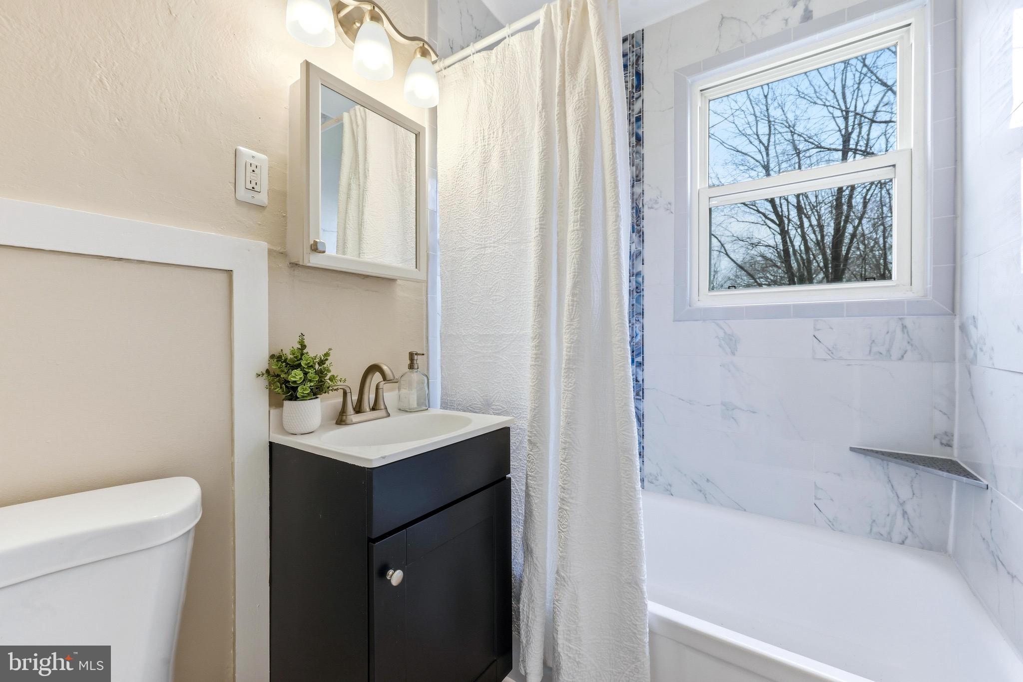 3 Victory Street Aberdeen, MD 21001 - Photo 13 of 26 a bath room with a sink a toilet and a bath tub