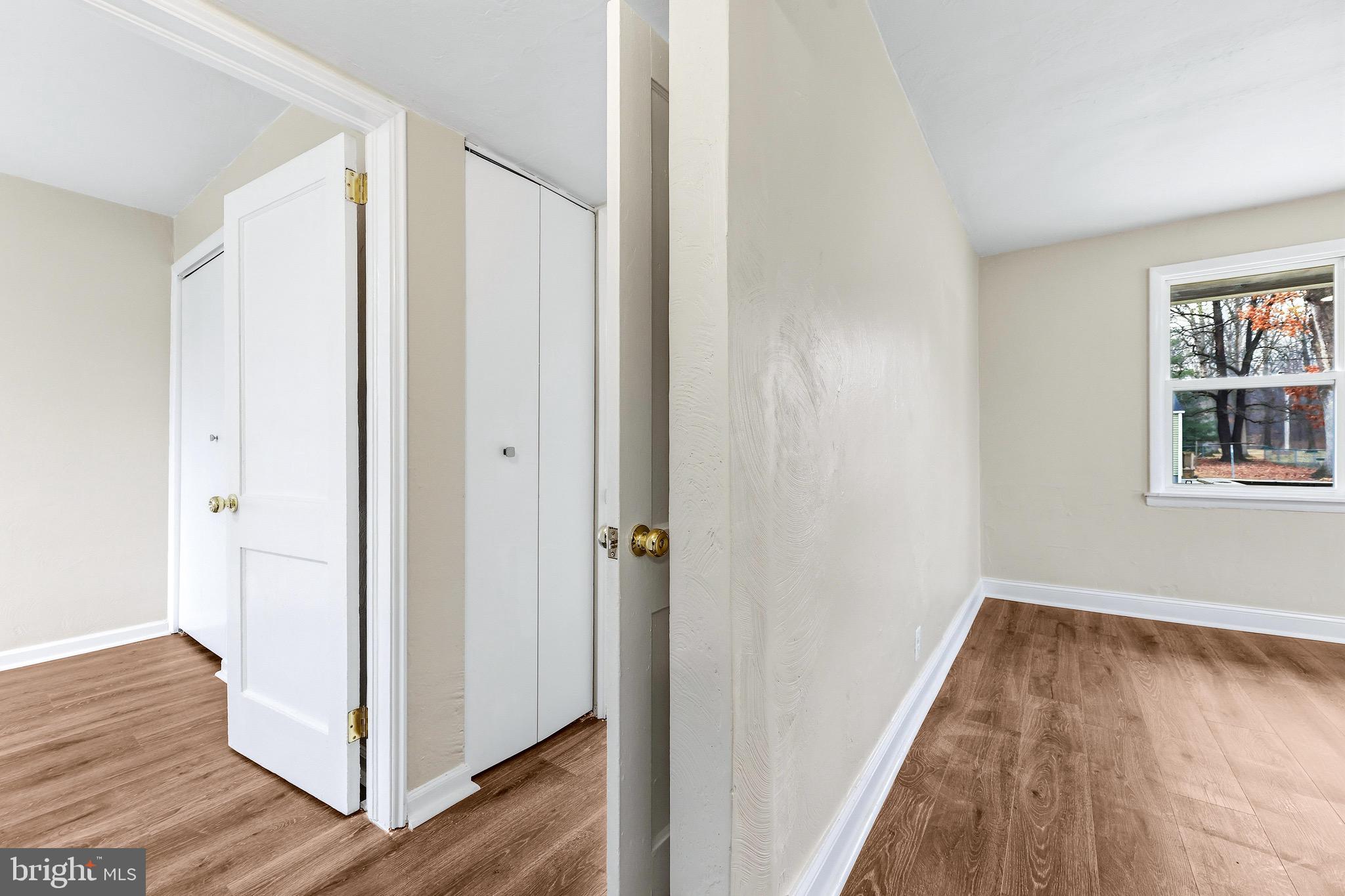 3 Victory Street Aberdeen, MD 21001 - Photo 16 of 26 a view of a hallway with wooden floor and closet
