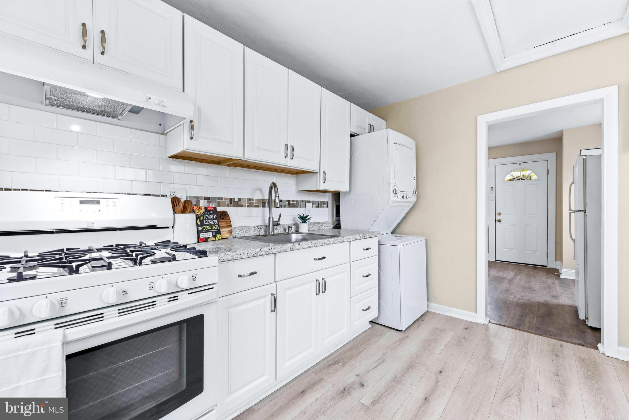 3 Victory Street Aberdeen, MD 21001 - Photo 5 of 26 a kitchen with cabinets appliances and wooden floor