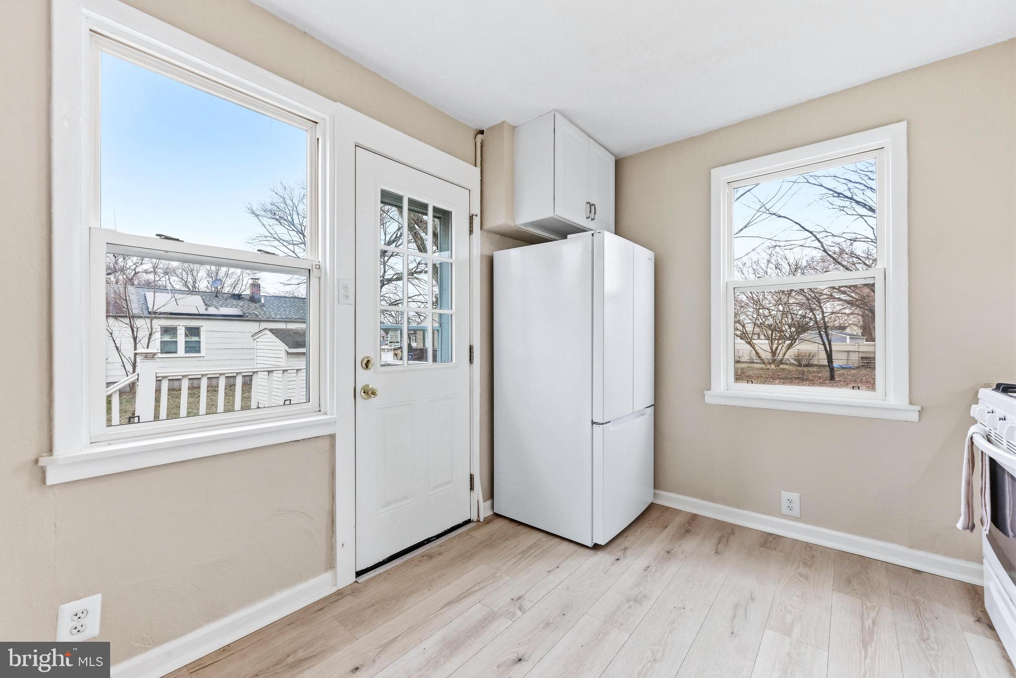 3 Victory Street Aberdeen, MD 21001 - Photo 6 of 26 a view of a kitchen with wooden floor and a window