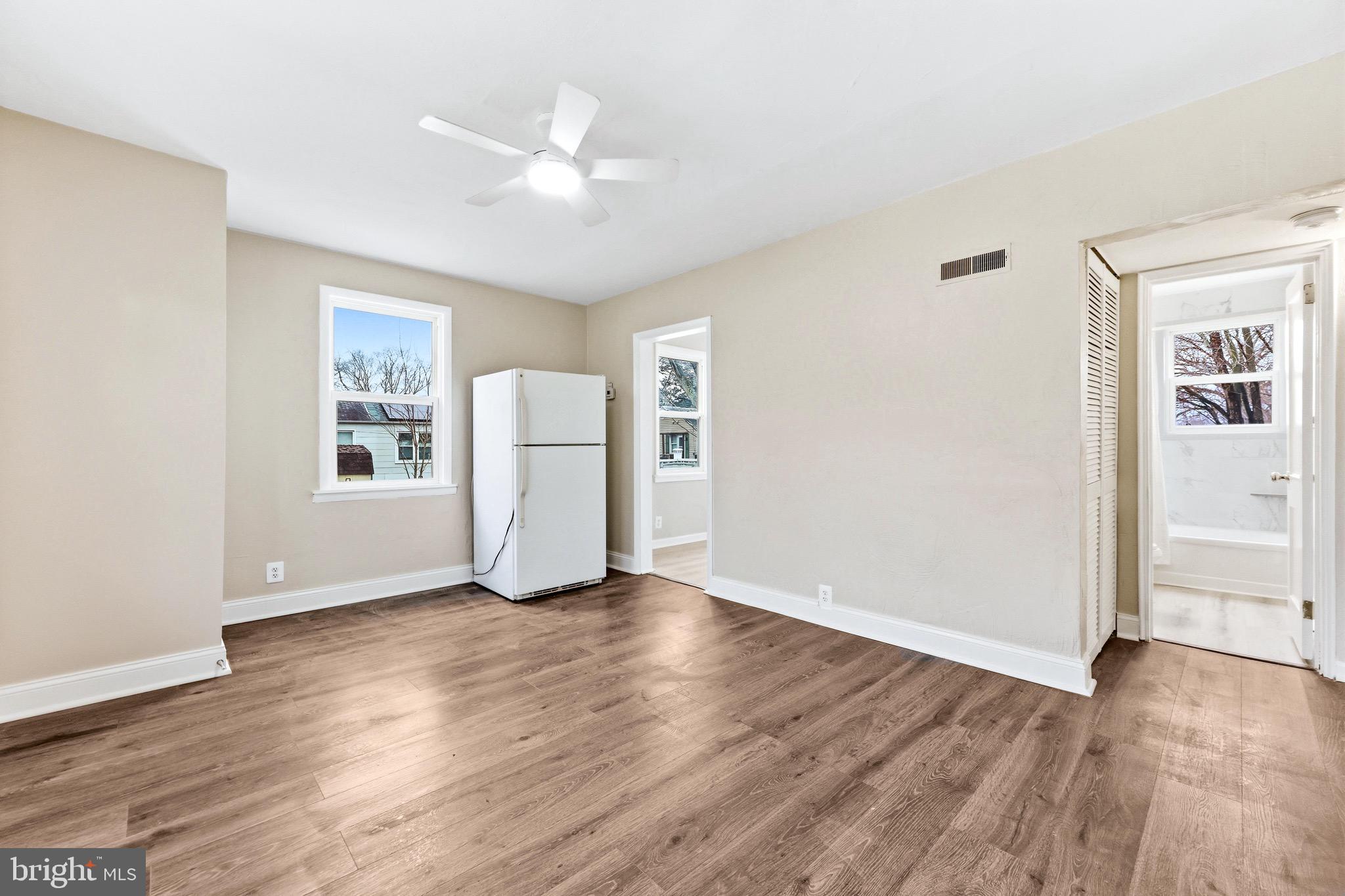 3 Victory Street Aberdeen, MD 21001 - Photo 10 of 26 wooden floor in an empty room with a window