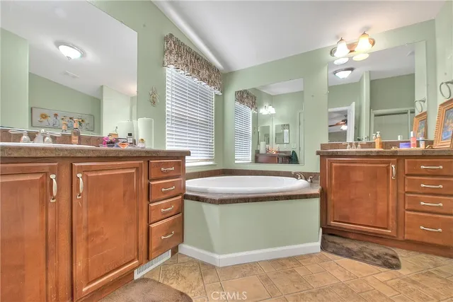 a view of walk in closet with clothes