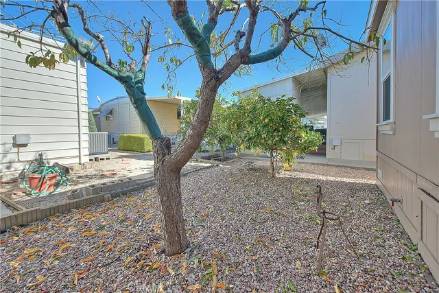 a view of a house with swimming pool and a yard
