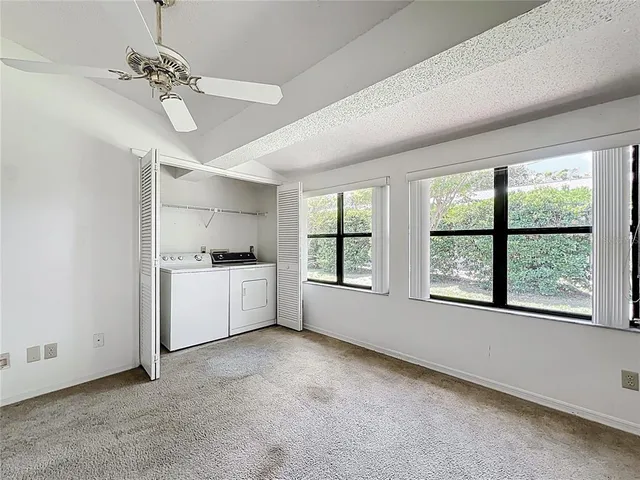a view of a room with window and cabinet