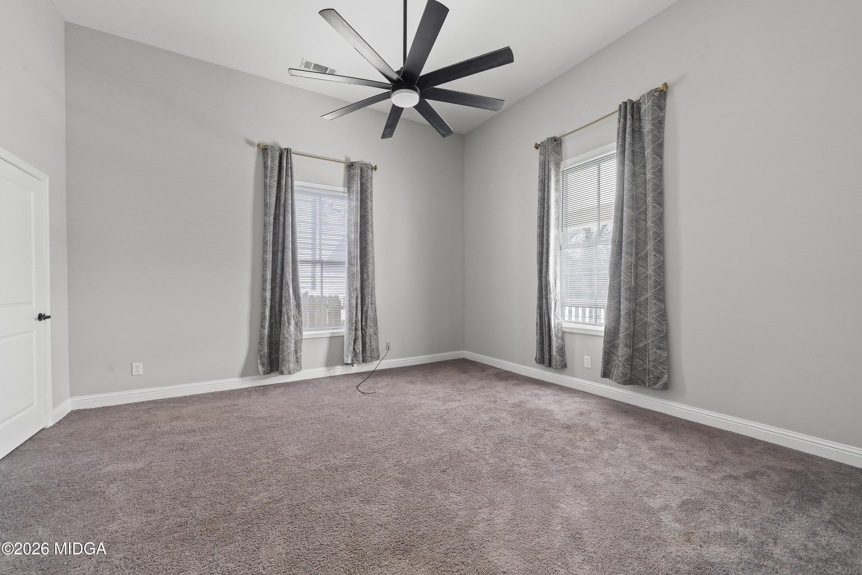 1471 Jackson Street Macon, GA 31201 - Photo 15 of 31 an empty room with windows and fan