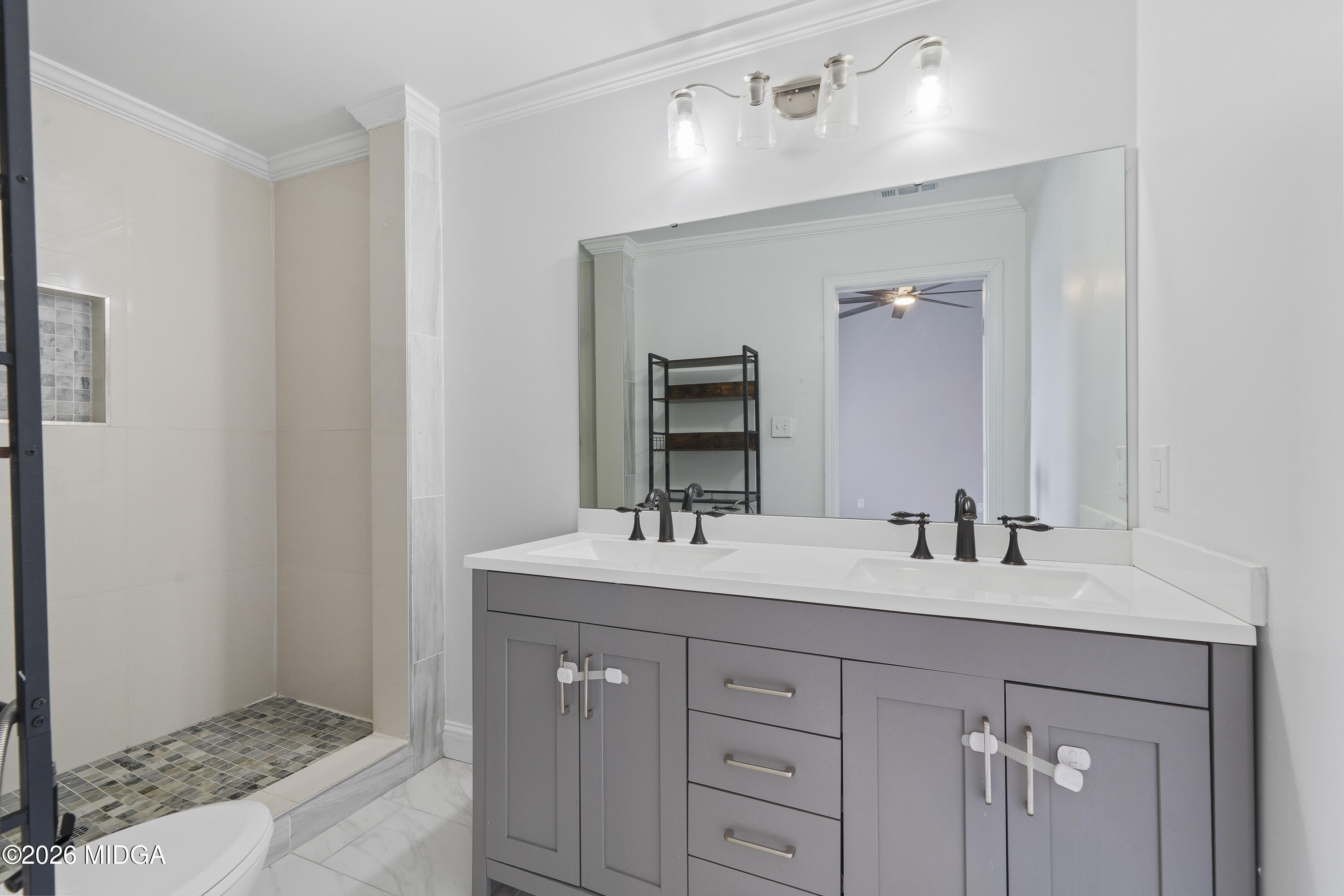1471 Jackson Street Macon, GA 31201 - Photo 19 of 31 a bathroom with a sink and a mirror