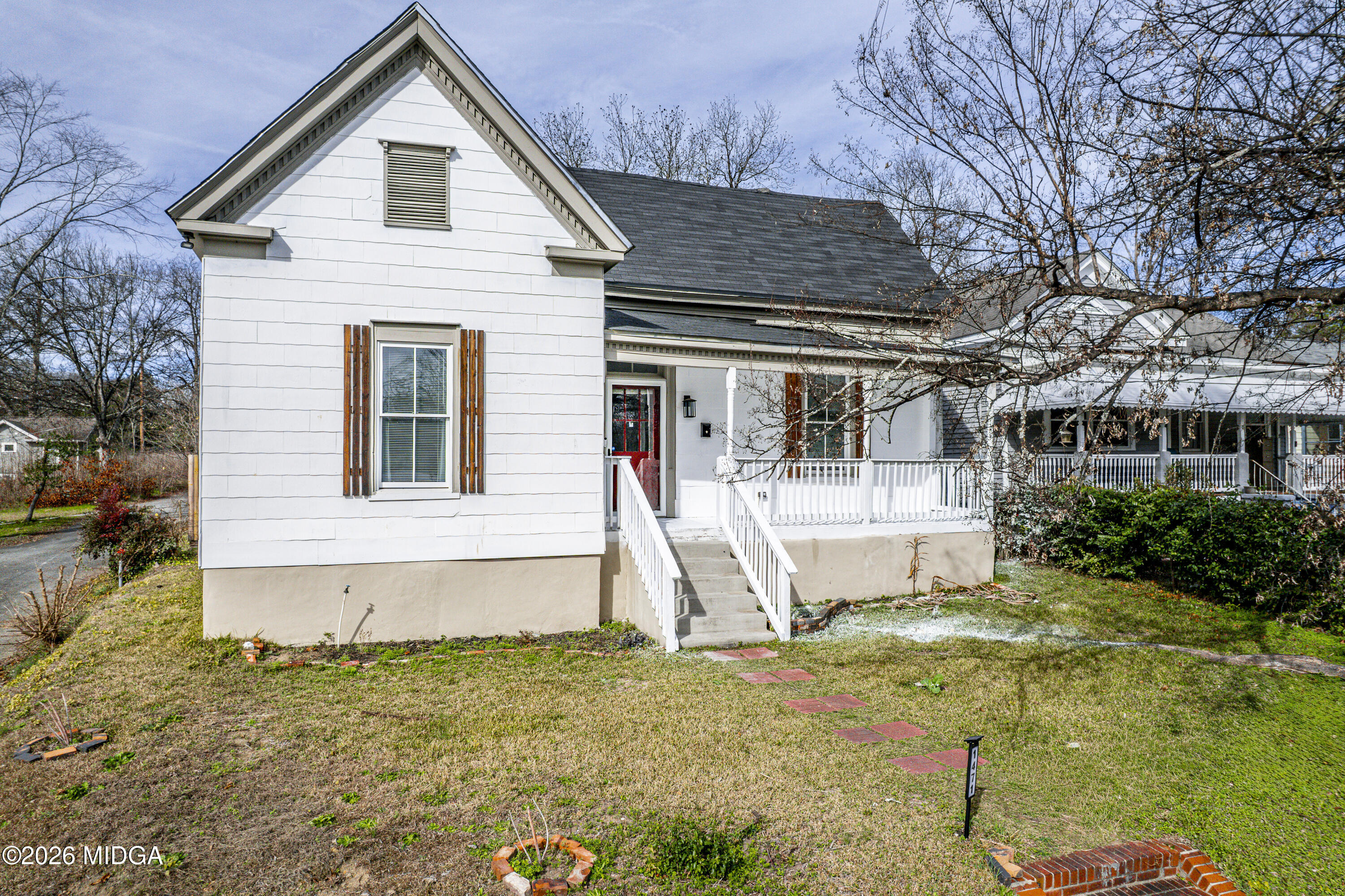 1471 Jackson Street Macon, GA 31201 - Photo 2 of 31 a front view of a house with a yard