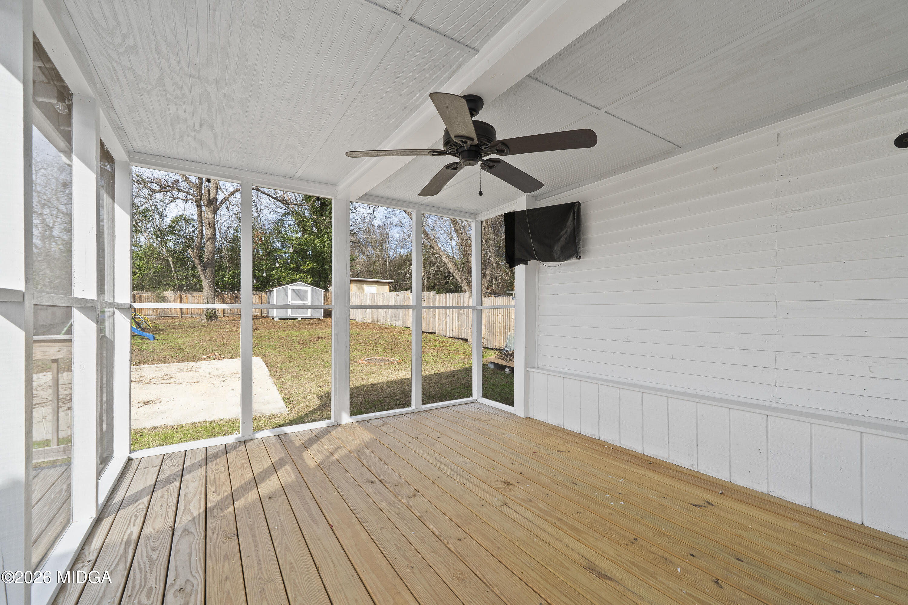 1471 Jackson Street Macon, GA 31201 - Photo 26 of 31 a view of empty room with wooden floor and fan