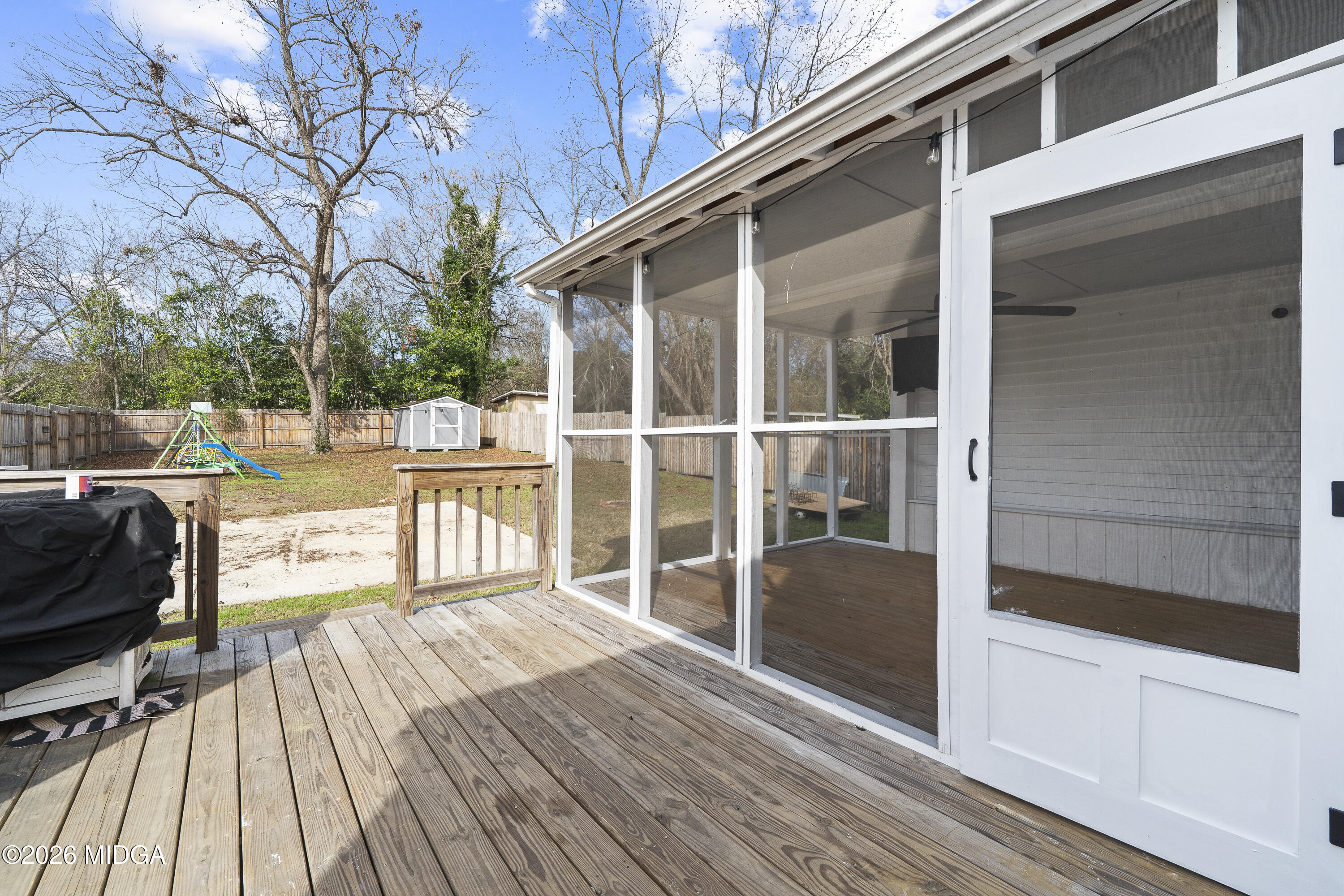 1471 Jackson Street Macon, GA 31201 - Photo 27 of 31 a view of a balcony with chairs and wooden floor