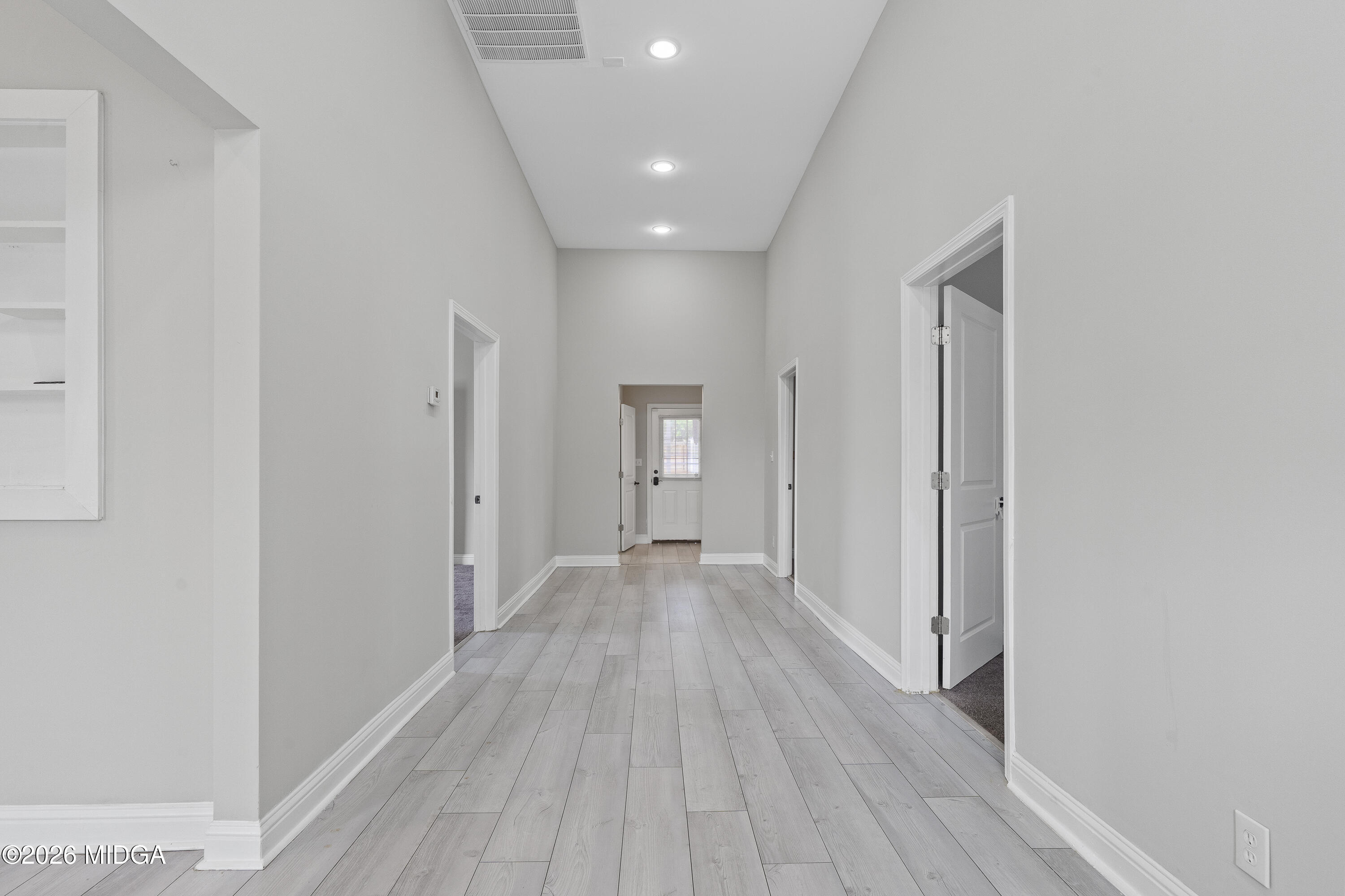 1471 Jackson Street Macon, GA 31201 - Photo 6 of 31 a view of a hallway with wooden floor