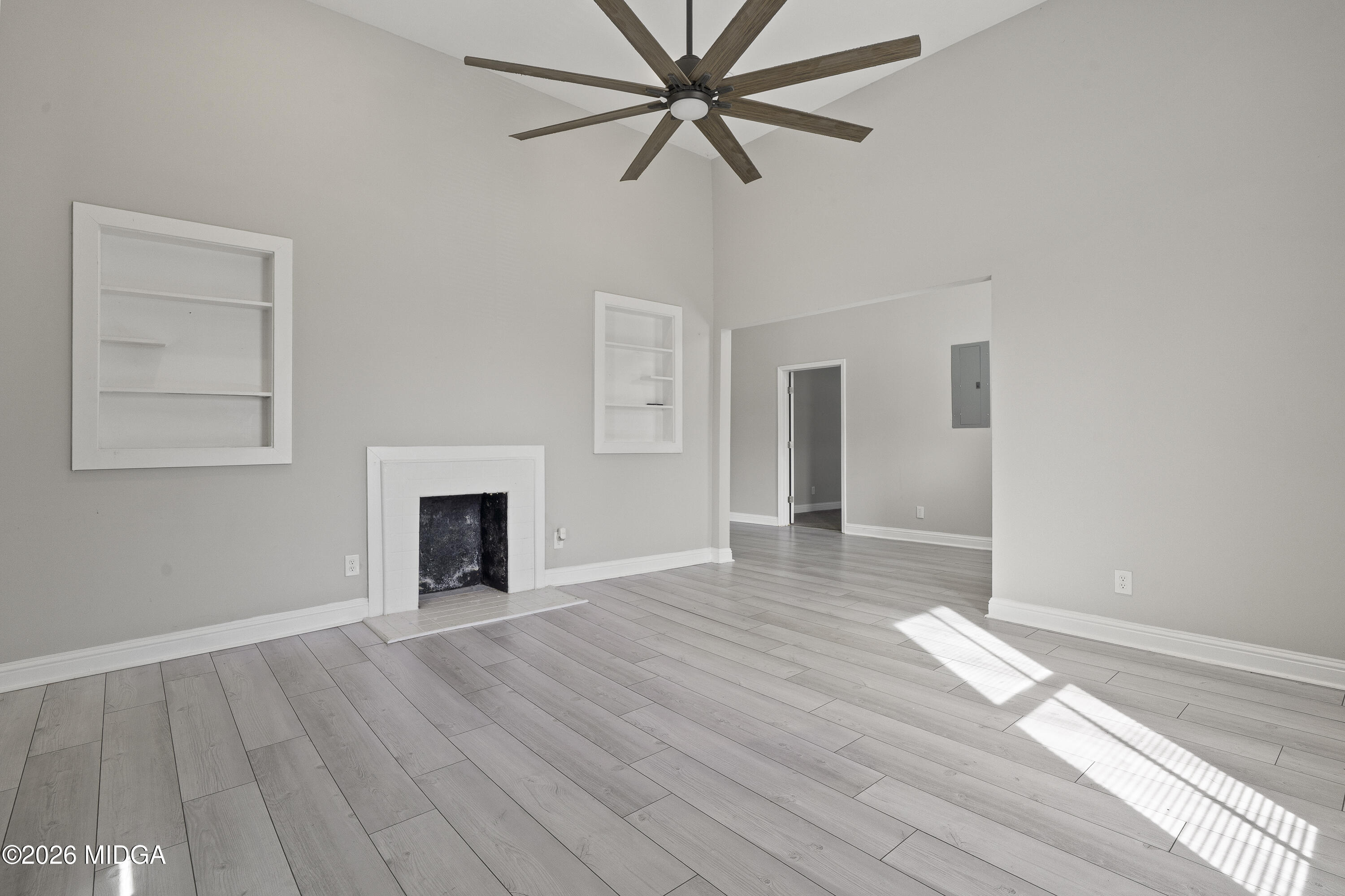 1471 Jackson Street Macon, GA 31201 - Photo 8 of 31 a view of empty room with wooden floor and fan
