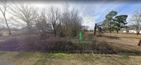 a view of backyard with green space