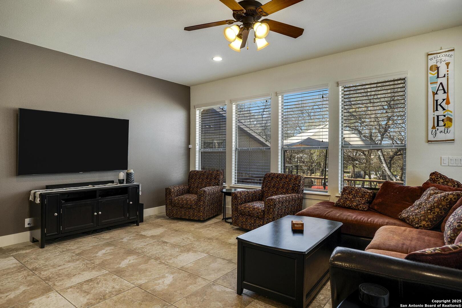 630 3 Oaks Road Seguin, TX 78155 - Photo 13 of 31 a living room with furniture and a flat screen tv
