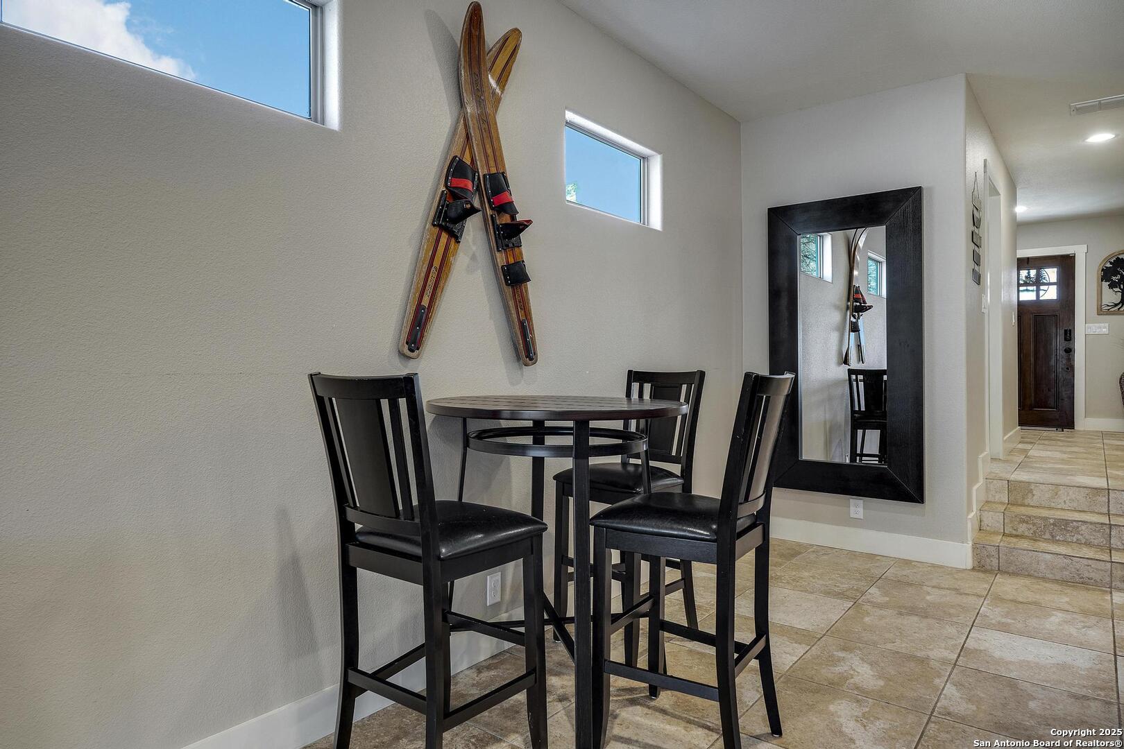 630 3 Oaks Road Seguin, TX 78155 - Photo 5 of 31 a view of a dining room with furniture and wooden floor