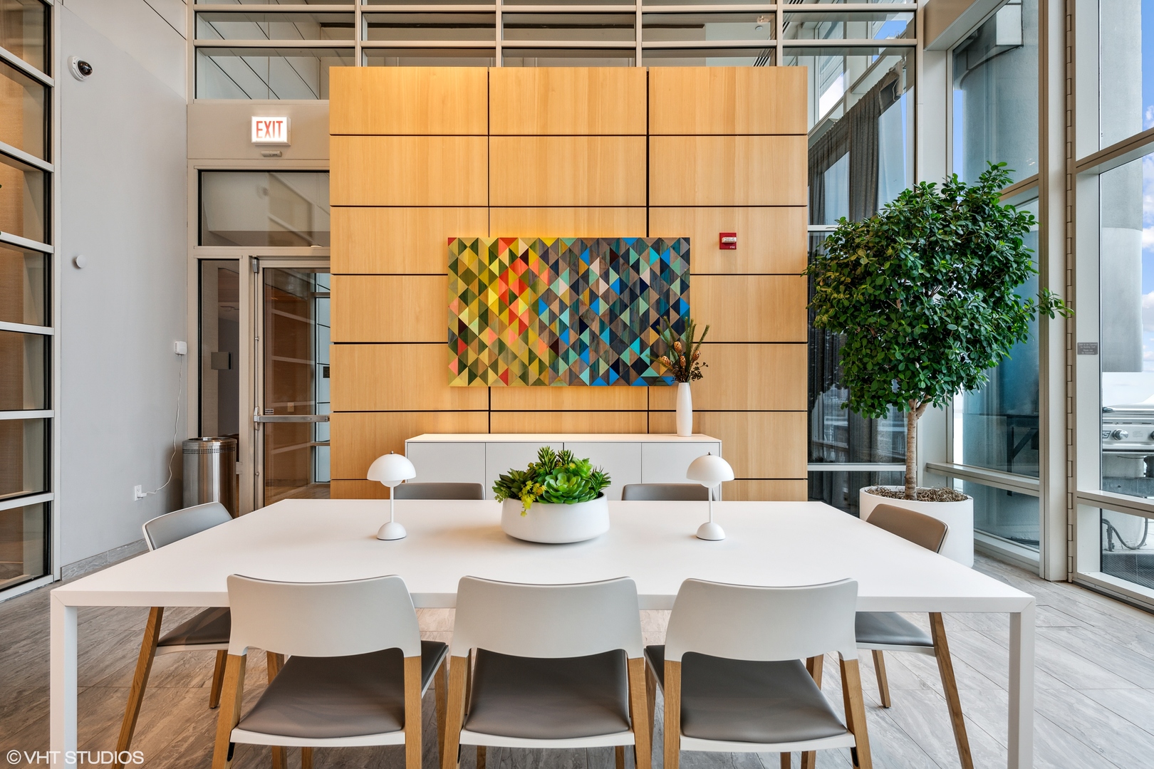 340 East Randolph Street, Unit 3304 Chicago, IL 60601 - Photo 35 of 39 a view of a dining room with furniture window and wooden floor