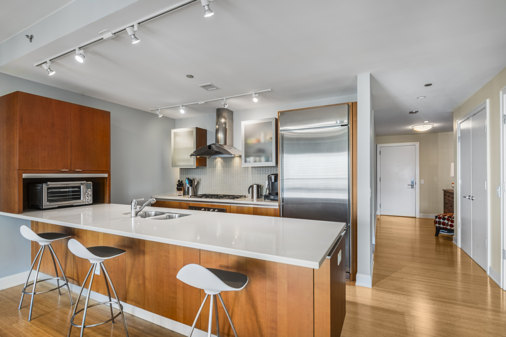 340 East Randolph Street, Unit 3304 Chicago, IL 60601 - Photo 5 of 39 a kitchen with stainless steel appliances granite countertop a sink a stove and a refrigerator