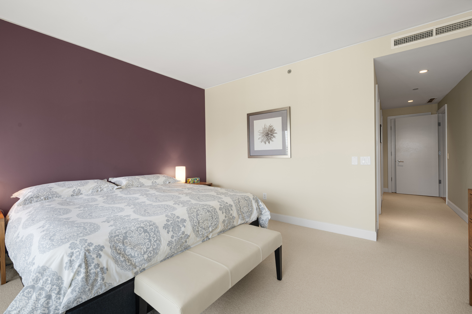 340 East Randolph Street, Unit 3304 Chicago, IL 60601 - Photo 9 of 39 a bedroom with a bed and a night stand