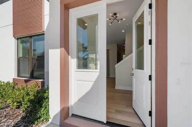 a view of a livingroom with a ceiling fan and window