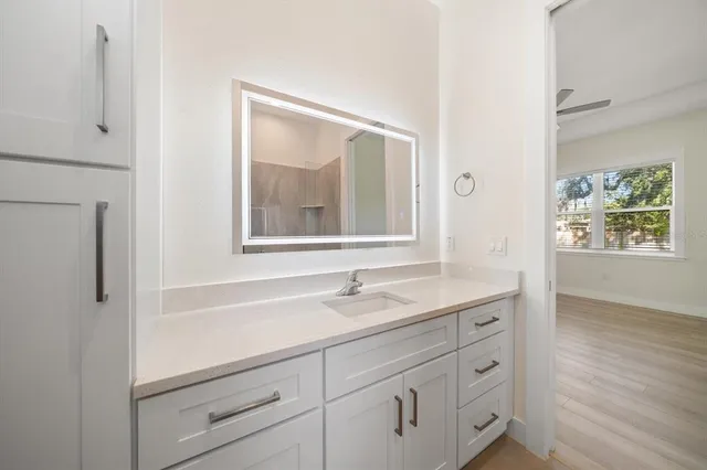 an empty room with a empty space and a ceiling fan