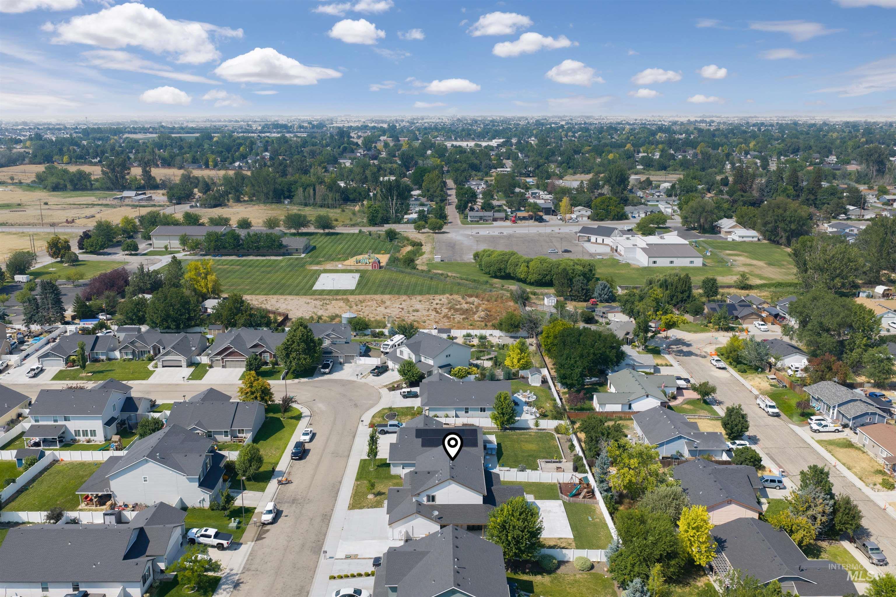 300 South Rocker Avenue Kuna, ID 83634 - Photo 45 of 49 Aerial perspective of a residential neighborhood with a variety of single-story and two-story homes