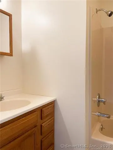 a bathroom with a bathtub and a sink