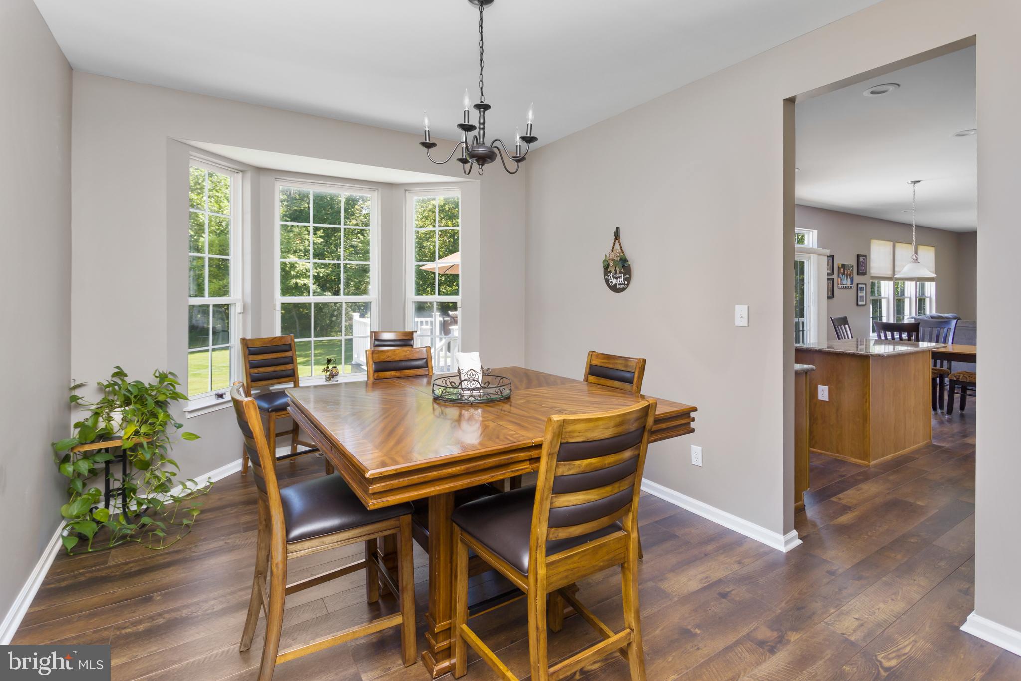 59 Birmingham Drive Columbus, NJ 08022 - Photo 12 of 45 a view of a dining room with furniture window and wooden floor