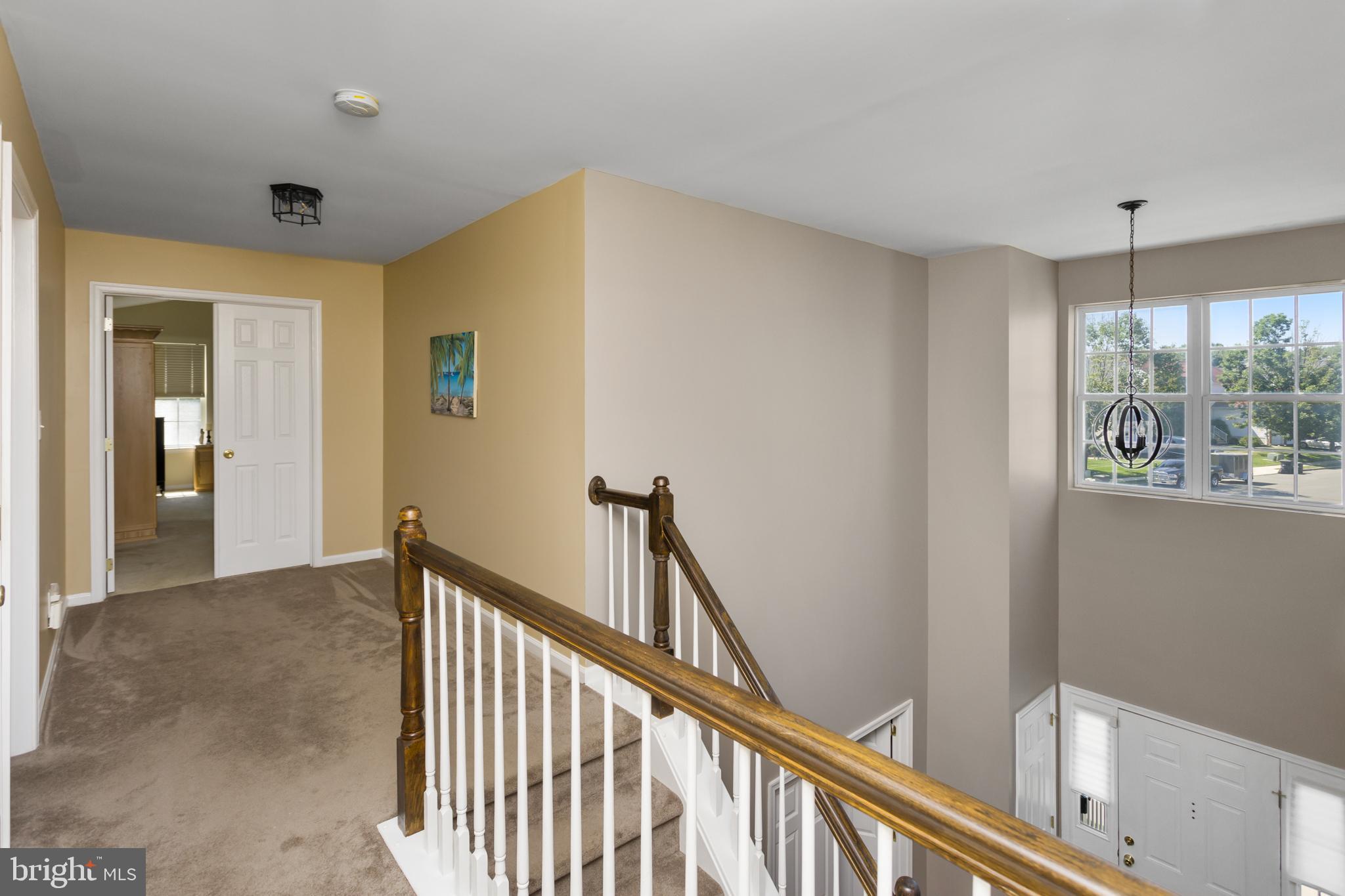 59 Birmingham Drive Columbus, NJ 08022 - Photo 23 of 45 a view of a hallway with wooden floor and stairs