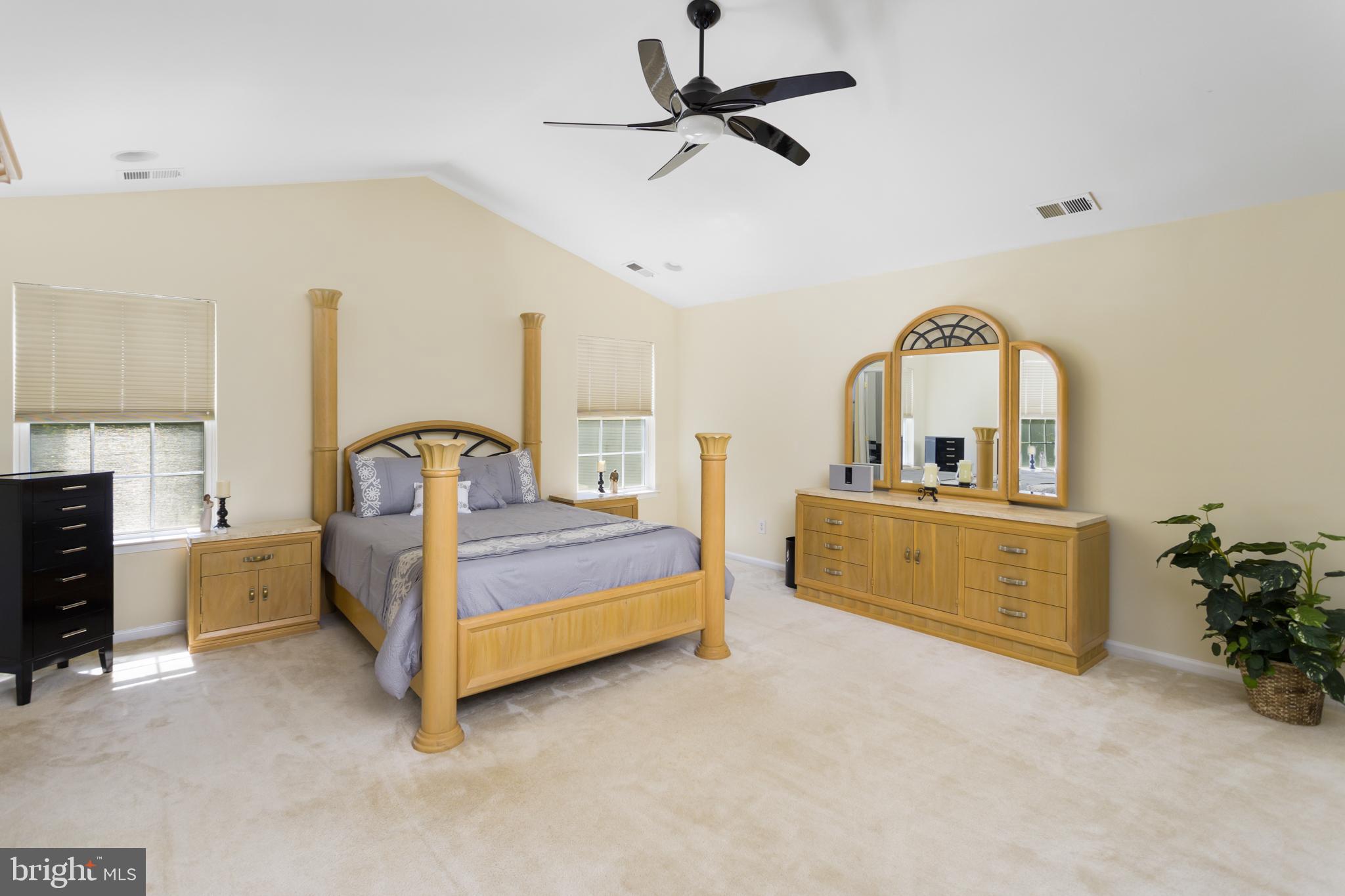 59 Birmingham Drive Columbus, NJ 08022 - Photo 25 of 45 a bedroom with bed and a chandelier