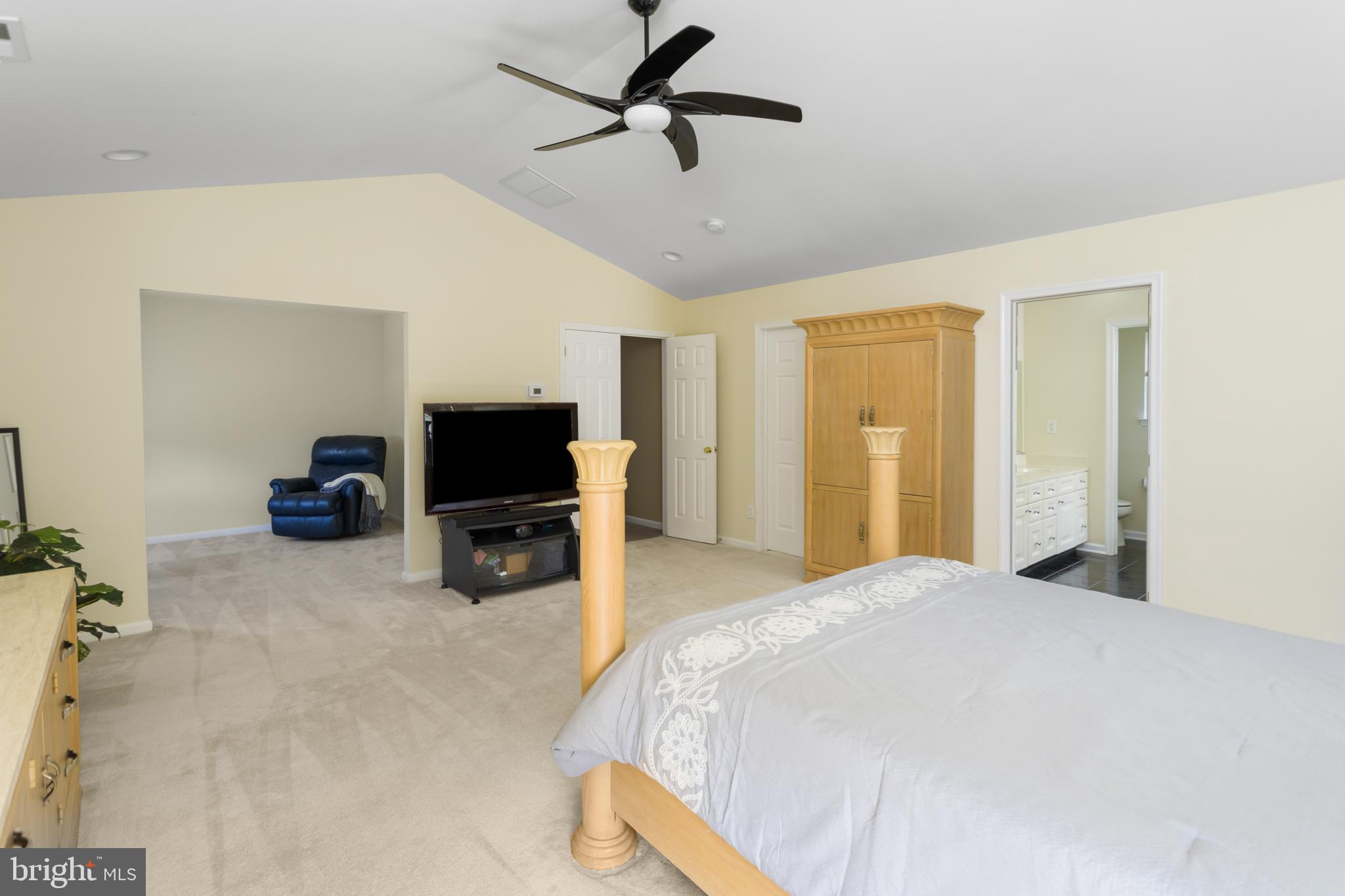 59 Birmingham Drive Columbus, NJ 08022 - Photo 26 of 45 a bedroom with a bed and a flat screen tv