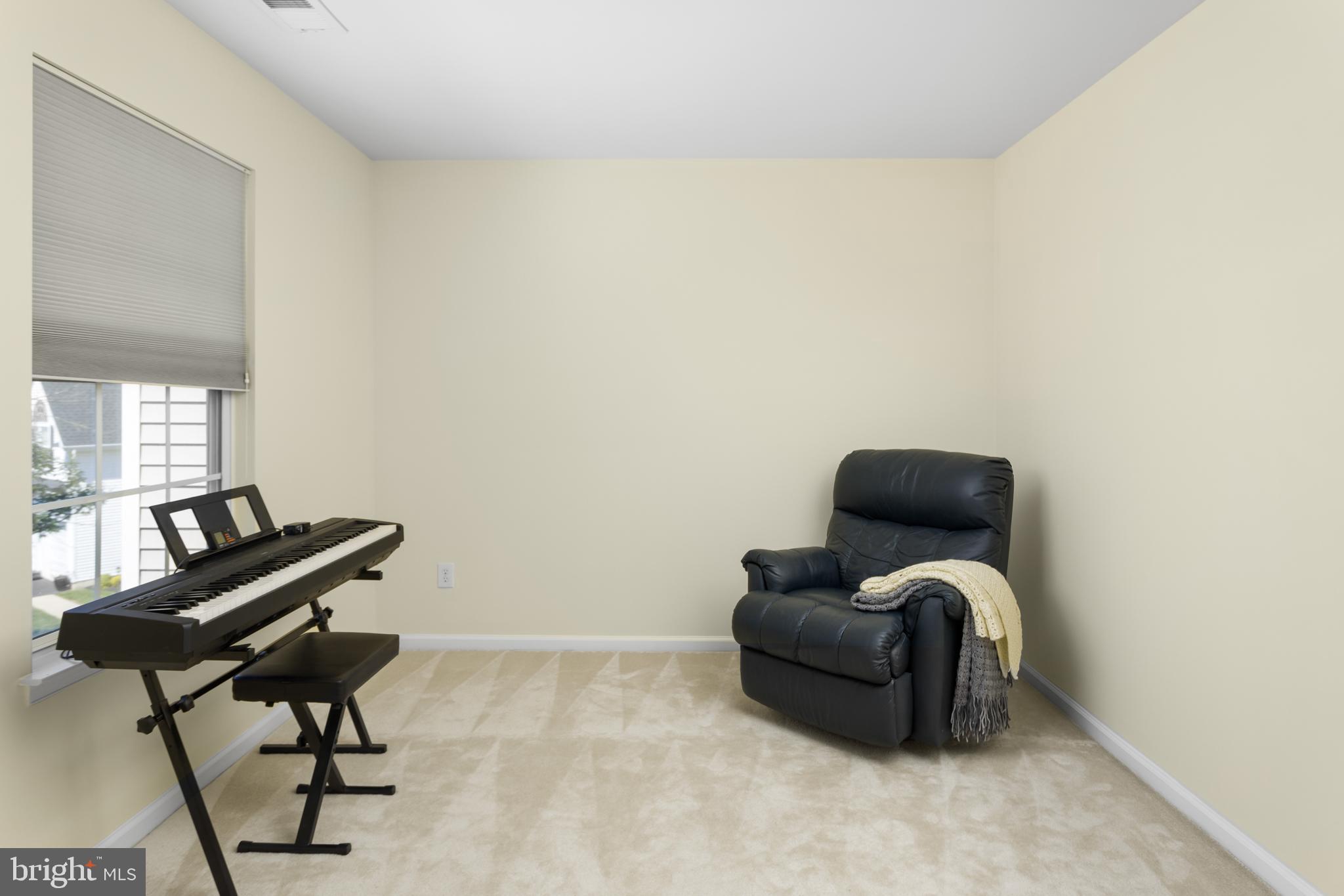 59 Birmingham Drive Columbus, NJ 08022 - Photo 27 of 45 a living room with furniture and a piano