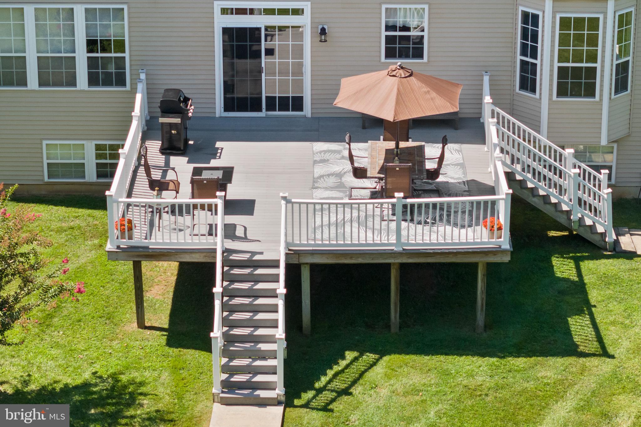 59 Birmingham Drive Columbus, NJ 08022 - Photo 38 of 45 a view of a patio with a table and chairs