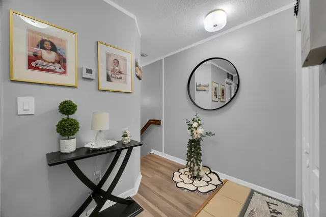 a living room with furniture and a ceiling fan