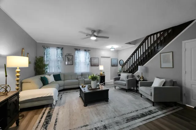 a white toilet sitting next to a white tub