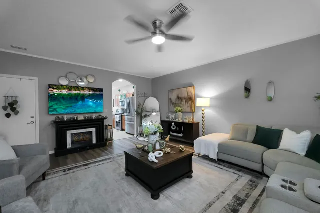 a kitchen with stainless steel appliances granite countertop a sink a stove and cabinets