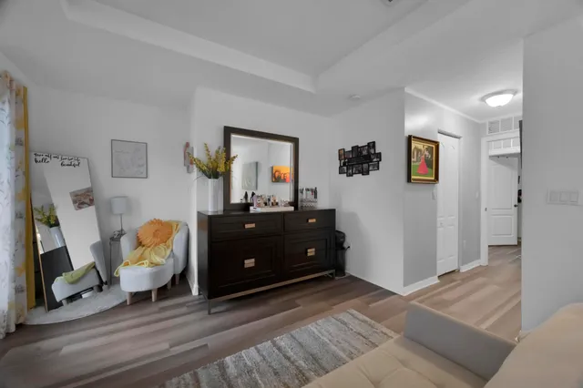 a bedroom with a bed couch and window
