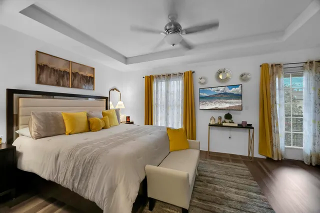 a room with a bed and a flat screen tv