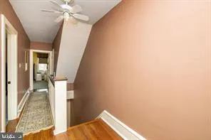 a view of a hallway with a white walls