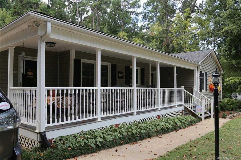 113 Sawtooth Lane, Unit 27 Stanley, NC 28164 - Photo 1 of 24 a view of a house with a small window and wooden fence