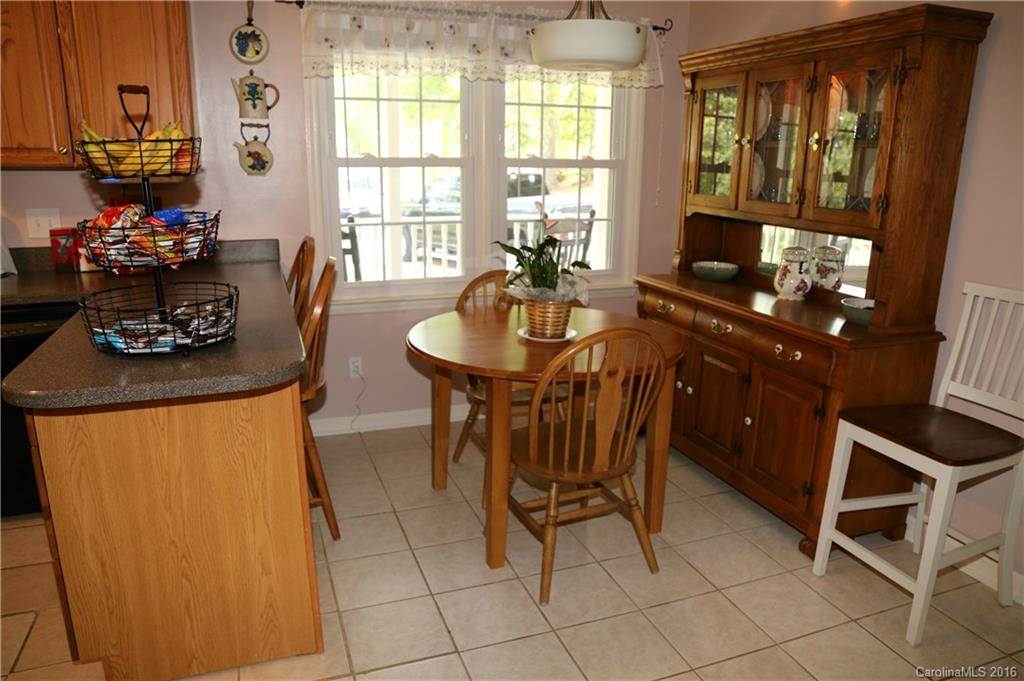 113 Sawtooth Lane, Unit 27 Stanley, NC 28164 - Photo 12 of 24 a dining room with furniture and window