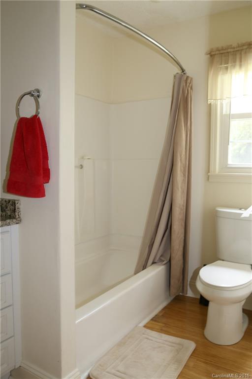 113 Sawtooth Lane, Unit 27 Stanley, NC 28164 - Photo 16 of 24 a bathroom with a toilet and a shower