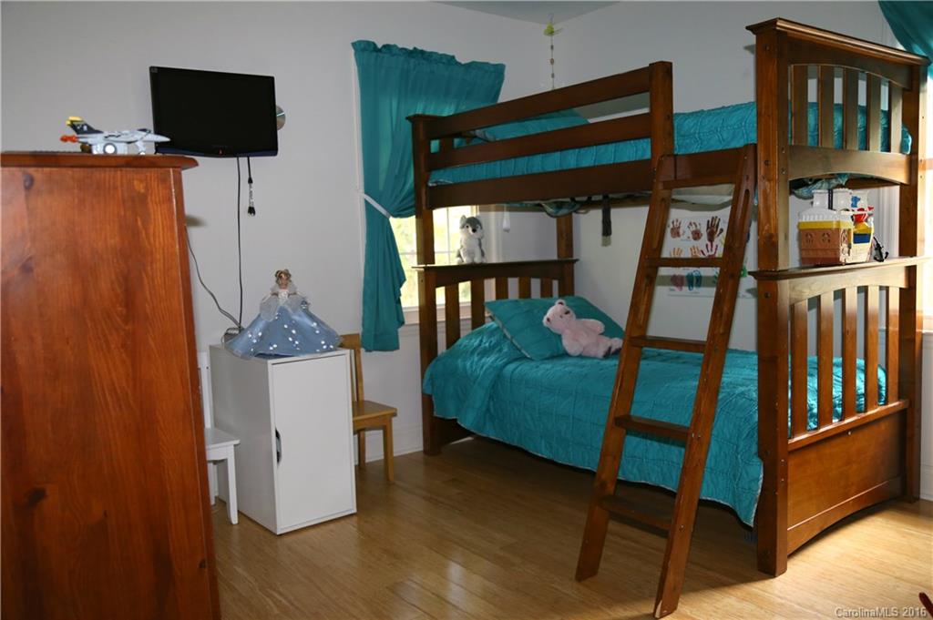 113 Sawtooth Lane, Unit 27 Stanley, NC 28164 - Photo 17 of 24 a bedroom with bunk bed