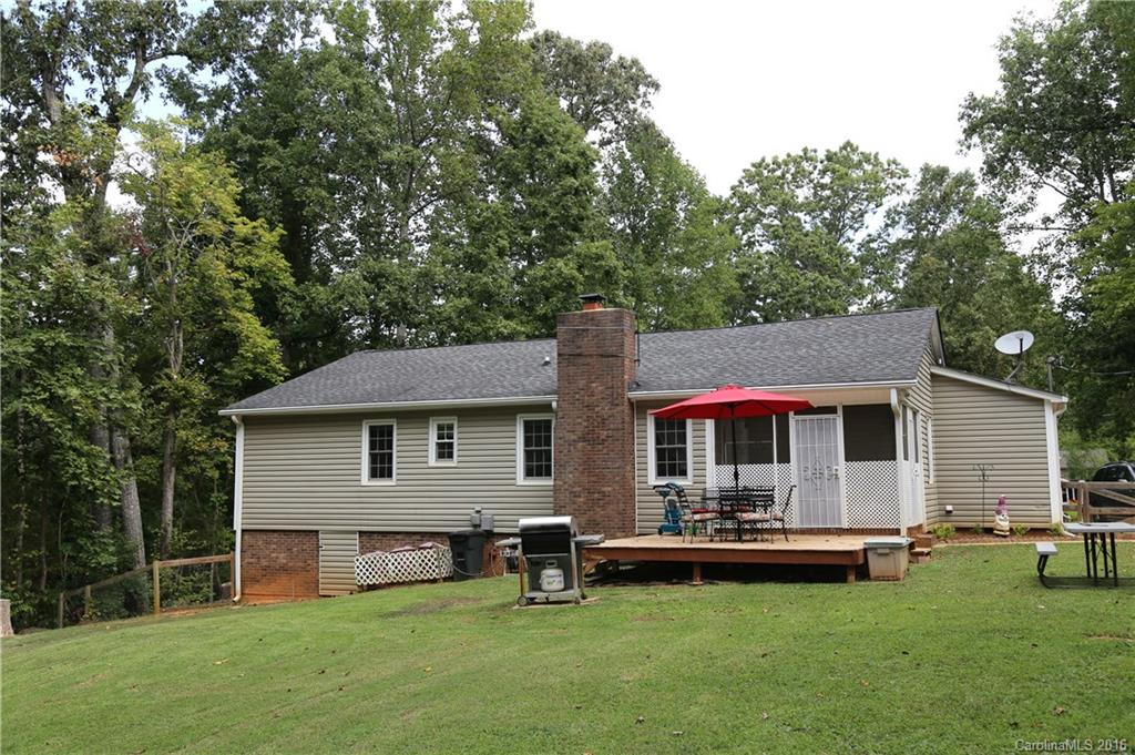 113 Sawtooth Lane, Unit 27 Stanley, NC 28164 - Photo 3 of 24 a front view of house with yard and chairs