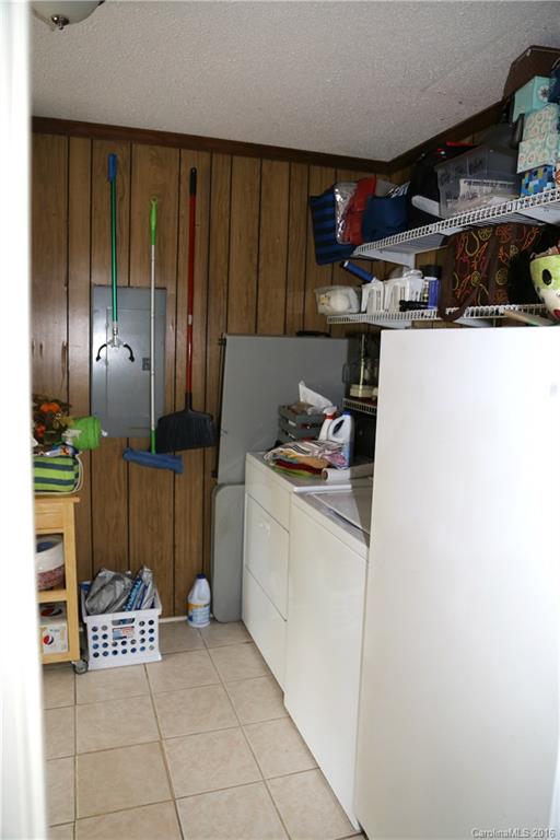 113 Sawtooth Lane, Unit 27 Stanley, NC 28164 - Photo 21 of 24 a kitchen with refrigerator and cabinets