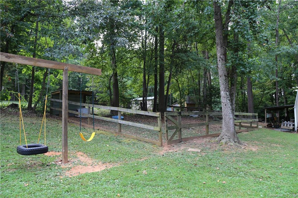 113 Sawtooth Lane, Unit 27 Stanley, NC 28164 - Photo 23 of 24 a view of a backyard with sitting area